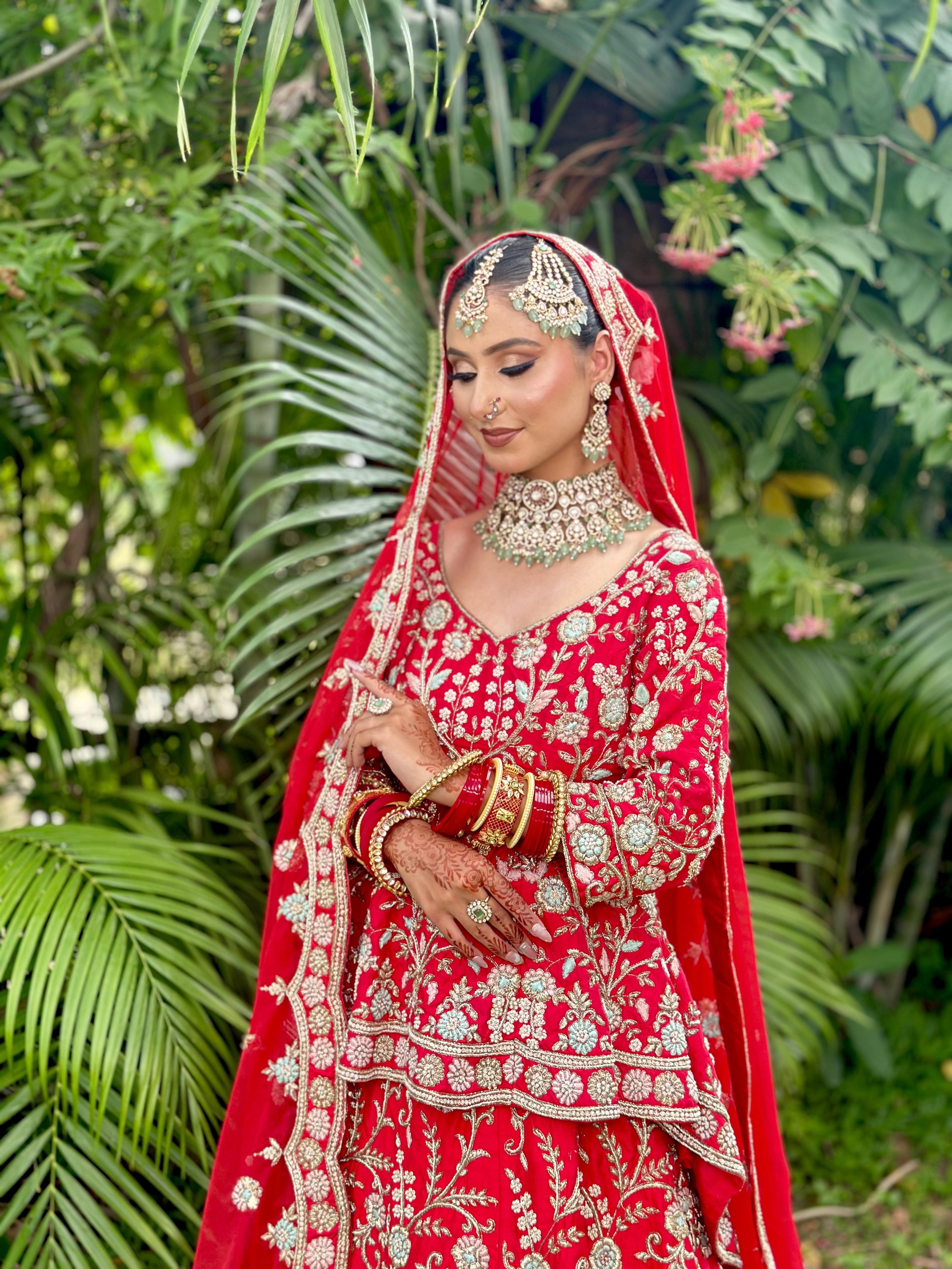 Royal Red Embroidered Bridal Lehenga & Chooda Setting — bridal makeup by Makeovers by Bhuvita, Chandigarh